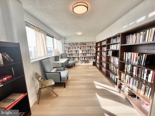 4515 Willard Avenue, Unit 1014S Chevy Chase, MD 20815 - Photo 17 of 35 a living room with furniture a bookshelf and a book shelf