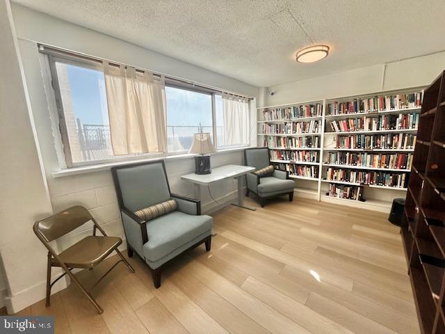 4515 Willard Avenue, Unit 1014S Chevy Chase, MD 20815 - Photo 19 of 35 a living room with furniture and a book shelf