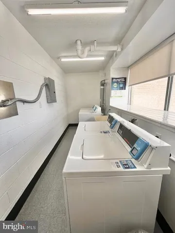 a room with a sink a window and couch