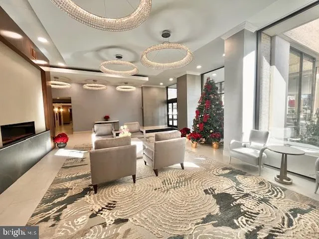 a living room with a couch and large windows