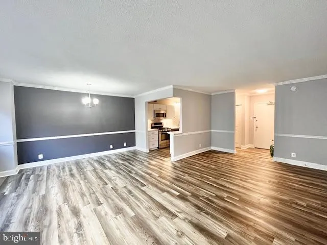 a view of a livingroom with wooden floor