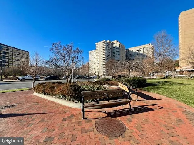 a swimming pool with outdoor space and seating area