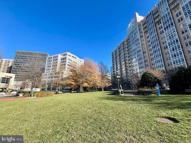 a view of a building with a yard