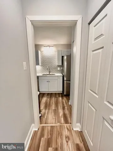 a bathroom with a sink and mirror