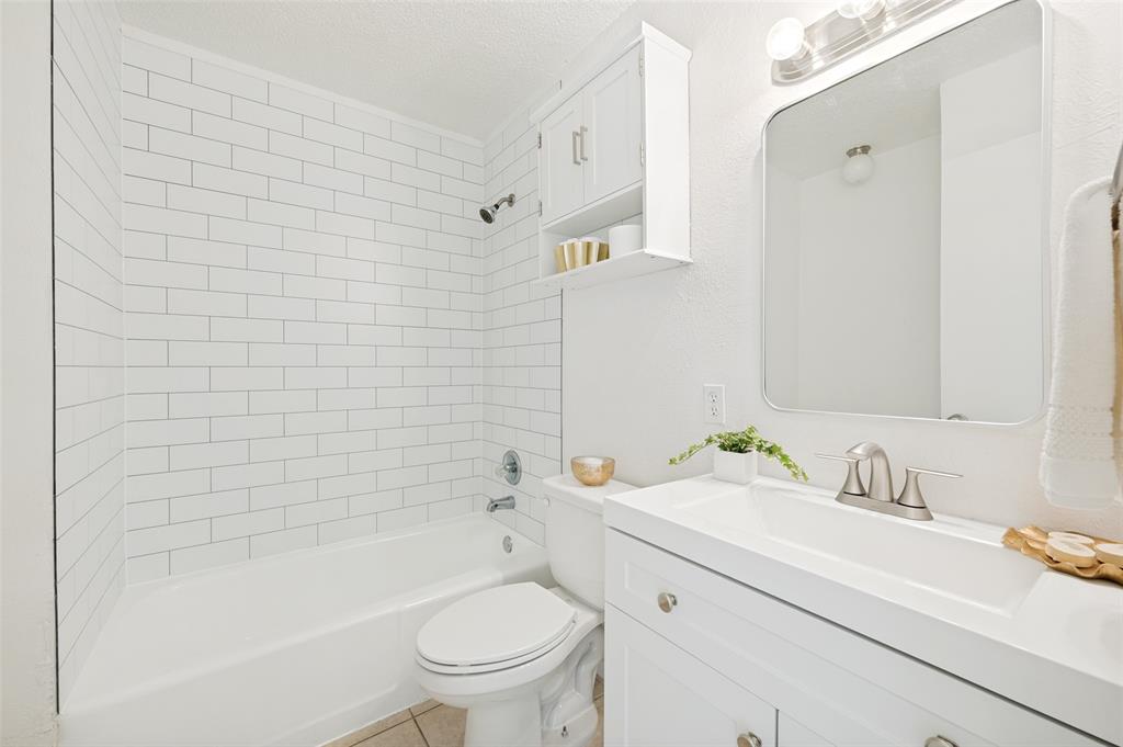 709 East Main Street Pilot Point, TX 76258 - Photo 10 of 11 a bathroom with a sink toilet and shower