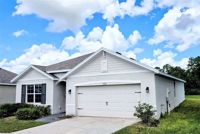 a front view of house with garden
