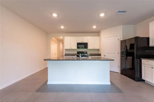 a large kitchen with cabinets