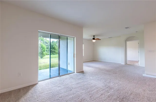 a view of kitchen with refrigerator sink and microwave