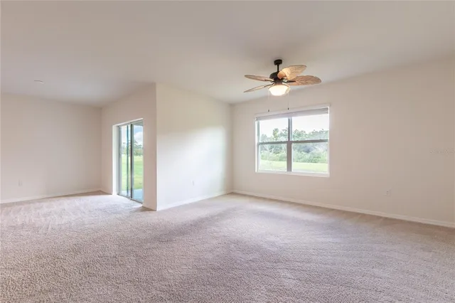 a view of a livingroom with a ceiling fan