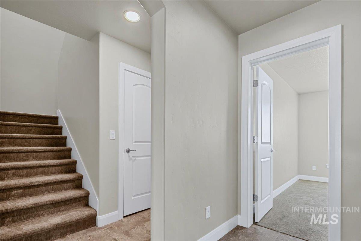 5850 West Rotherham Drive Eagle, ID 83616 - Photo 22 of 50 Upper cabinetry with wood-finish doors and brushed nickel hardware