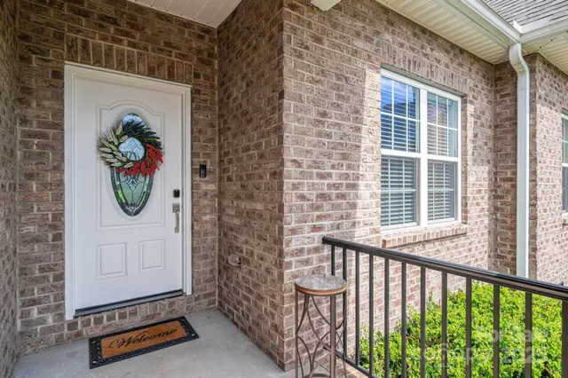 a front view of a house with glass windows