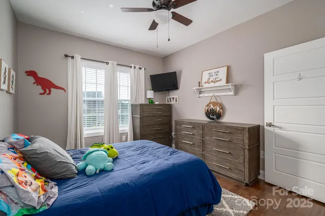 a bedroom with furniture and a window