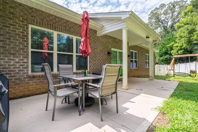 a view of an outdoor sitting area with furniture