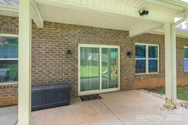 a view of livingroom with furniture and floor to ceiling window