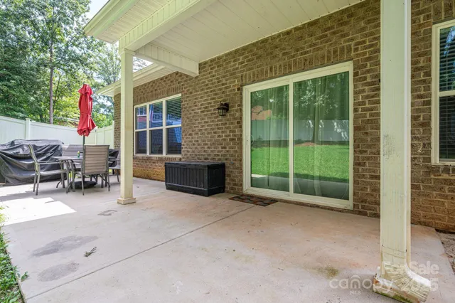a view of a backyard with sitting area
