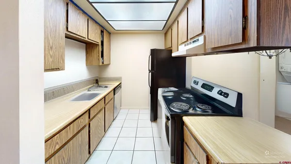 a kitchen with stainless steel appliances granite countertop a stove and a refrigerator
