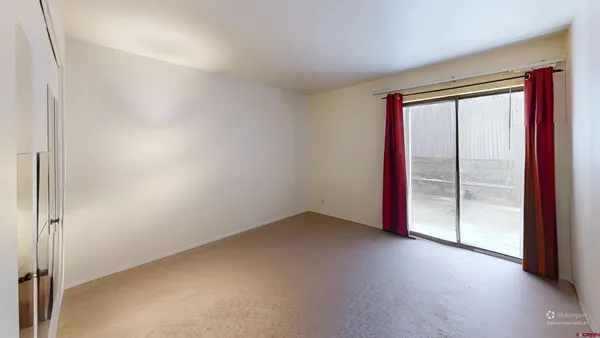 an empty room with sliding door