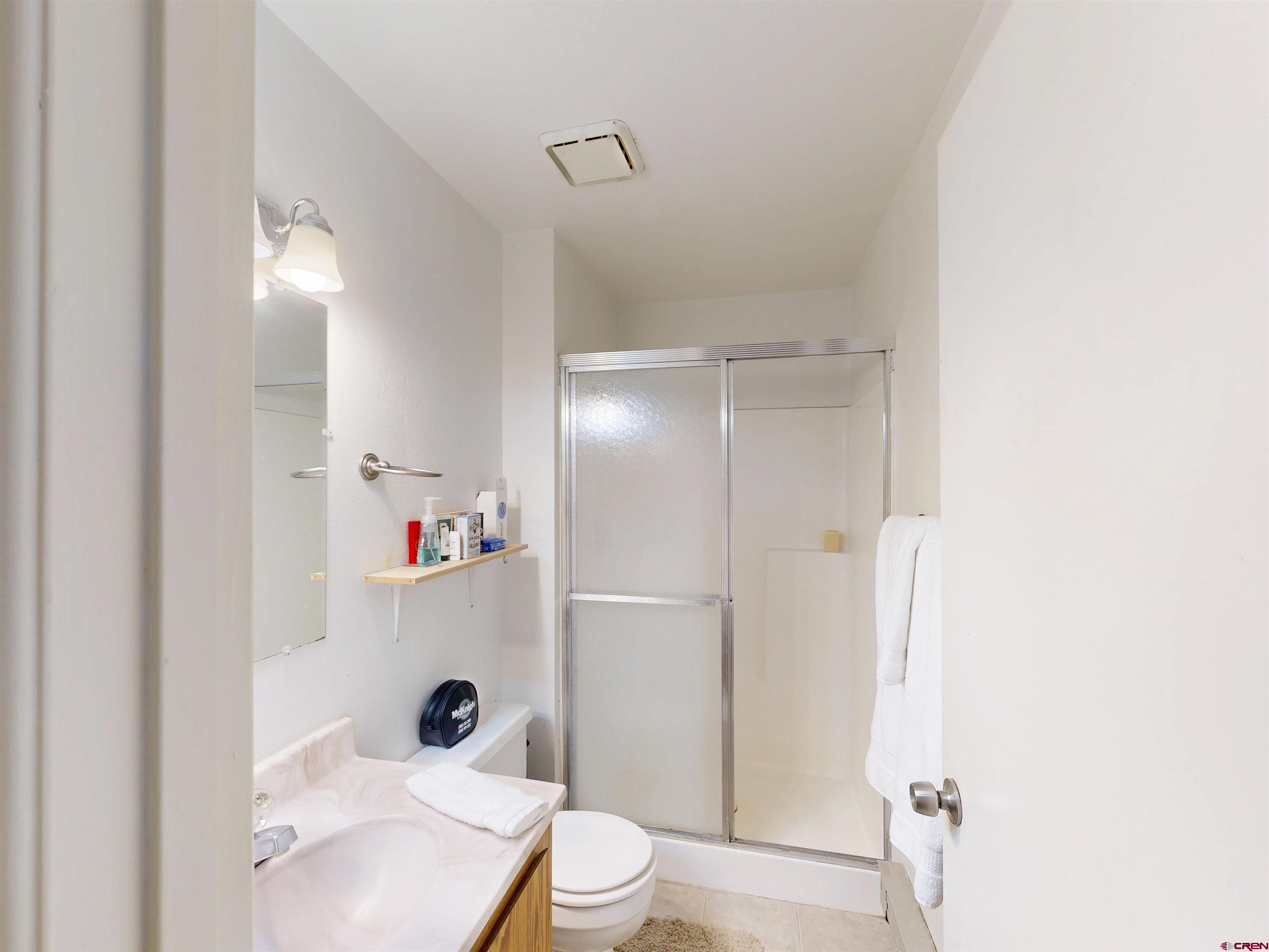 1200 Florida Road, Unit 33 Durango, CO 81301 - Photo 7 of 22 a bathroom with a sink toilet and shower