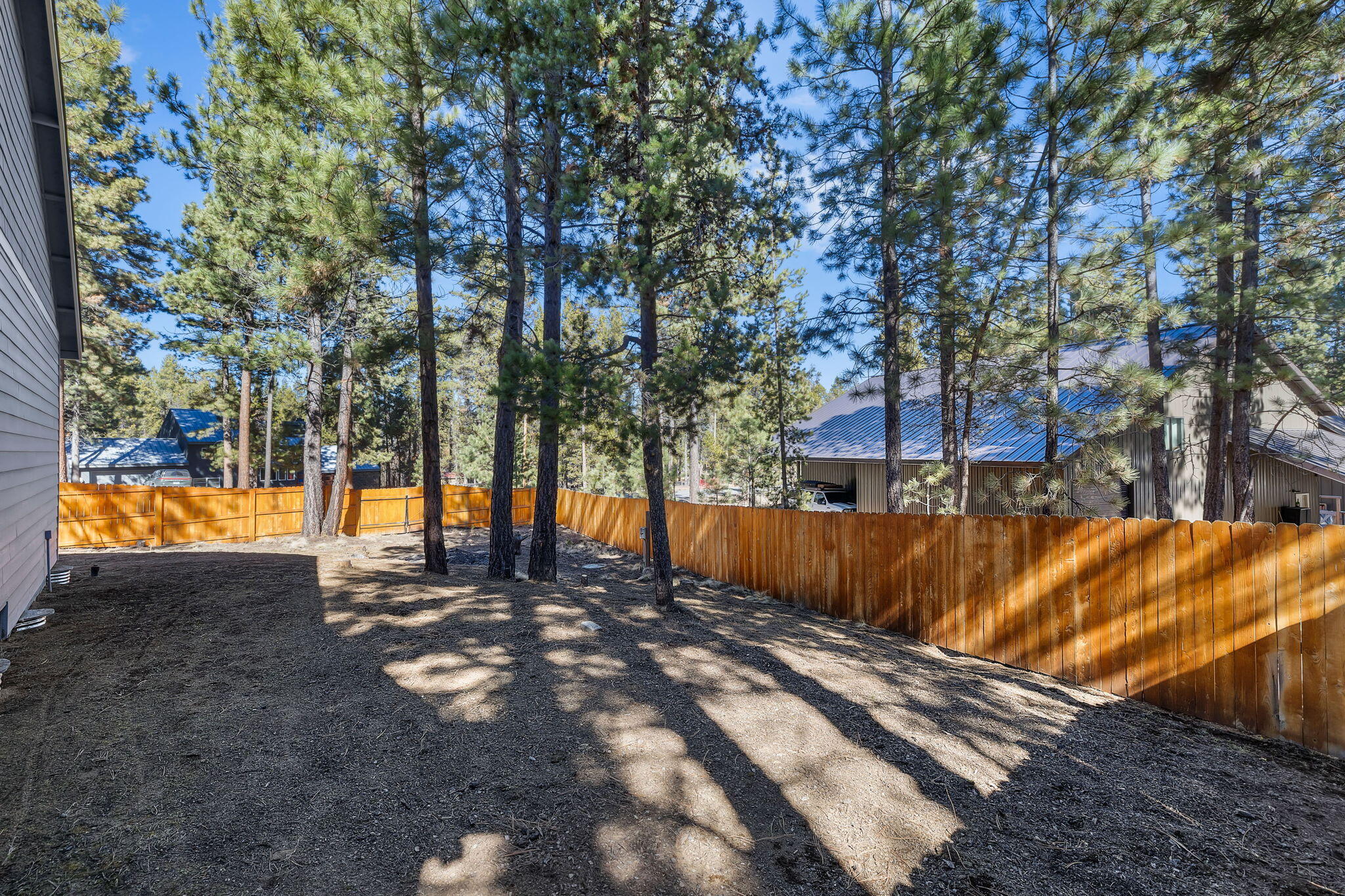 17064 Sacramento Road Bend, OR 97707 - Photo 32 of 50 a view of a yard with an trees