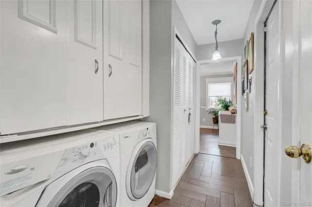 a view of a hallway with washer and dryer