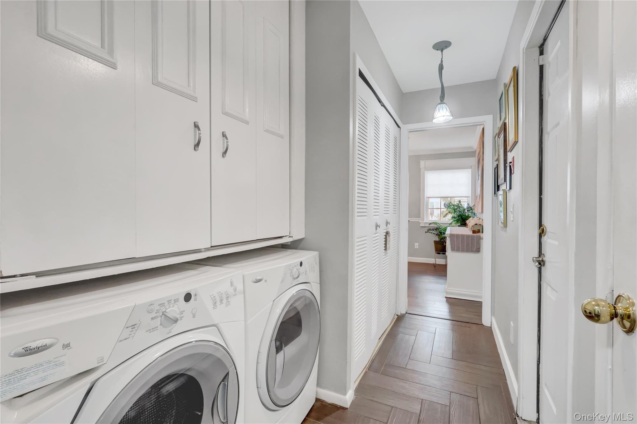 14 Chipmunk Trail Coram, NY 11727 - Photo 14 of 41 a view of a hallway with washer and dryer