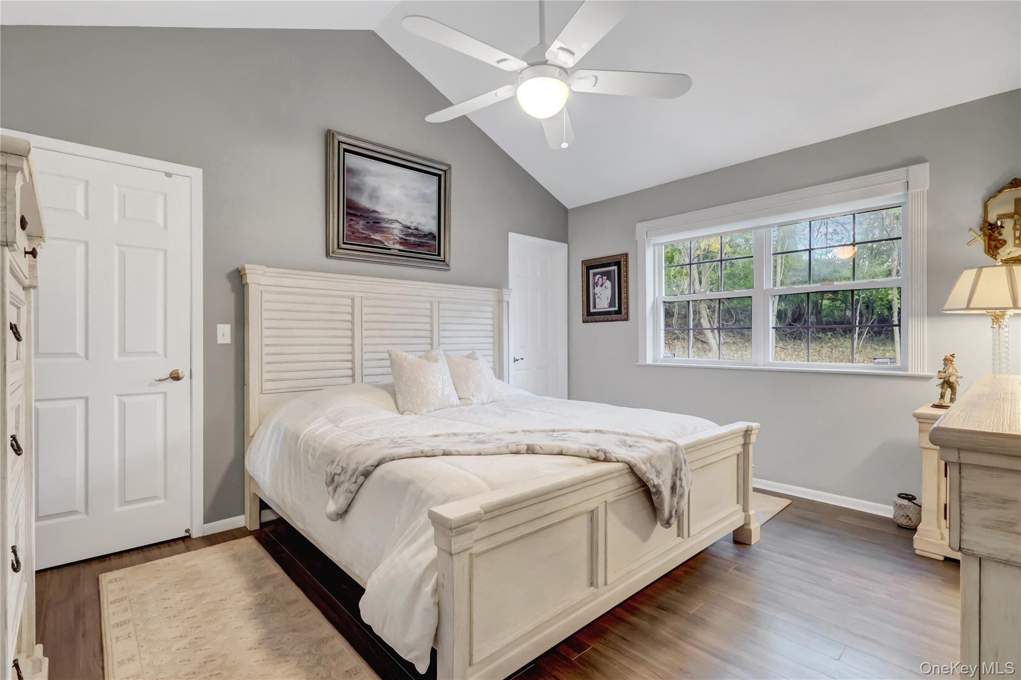 14 Chipmunk Trail Coram, NY 11727 - Photo 15 of 41 a bed sitting in a bedroom next to a window