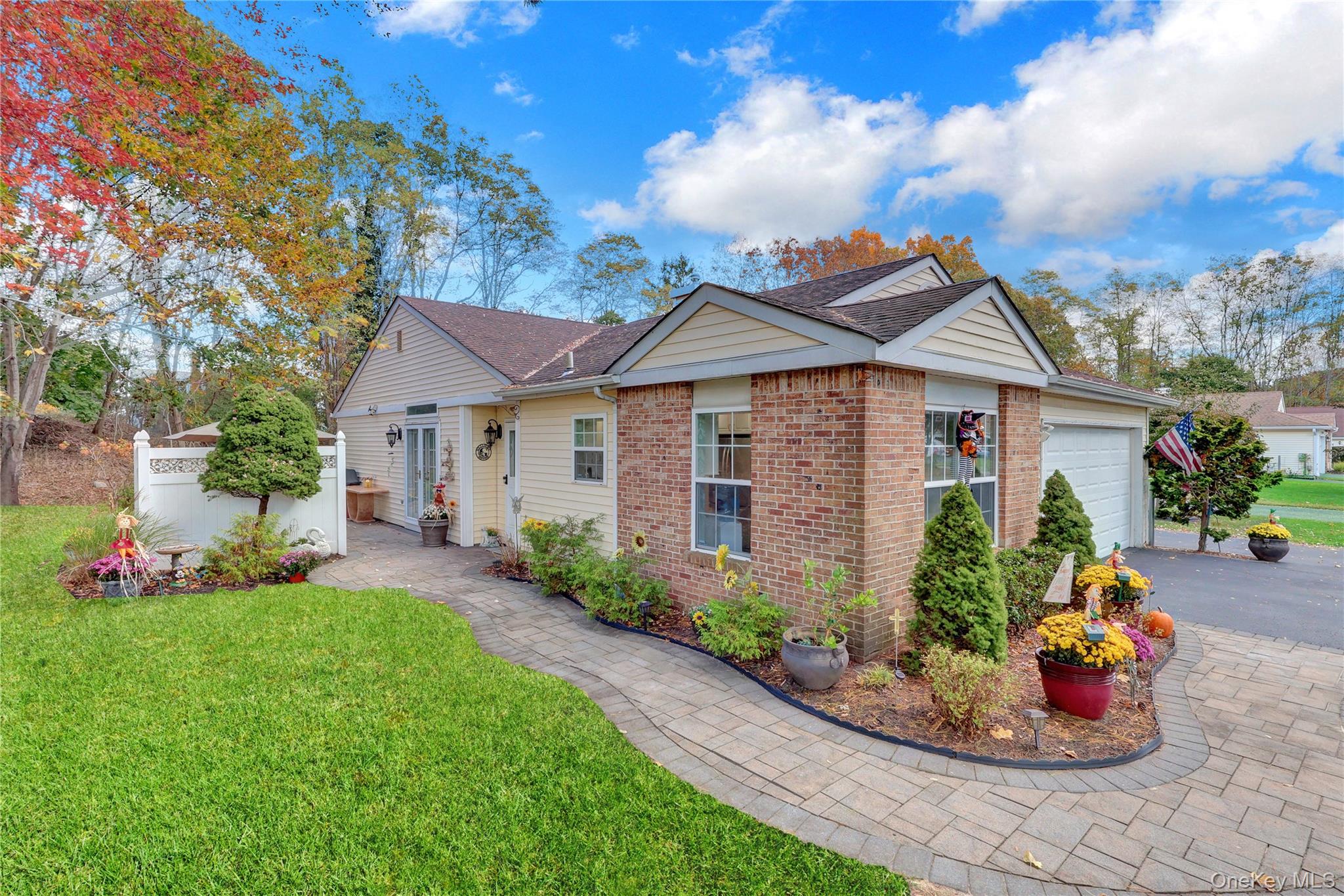 14 Chipmunk Trail Coram, NY 11727 - Photo 3 of 41 a front view of a house with a garden