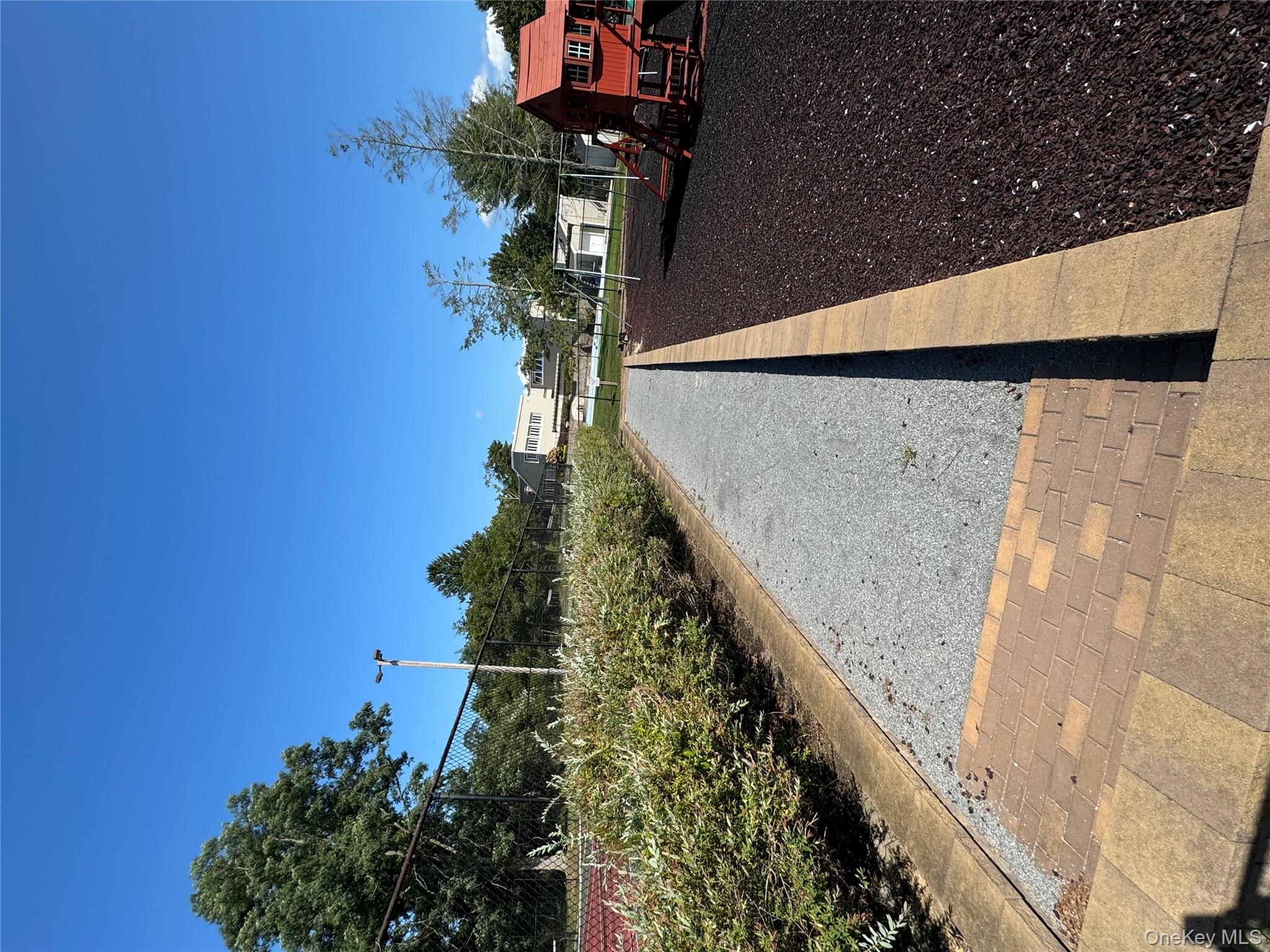 14 Chipmunk Trail Coram, NY 11727 - Photo 33 of 41 a view of a street with cars on road