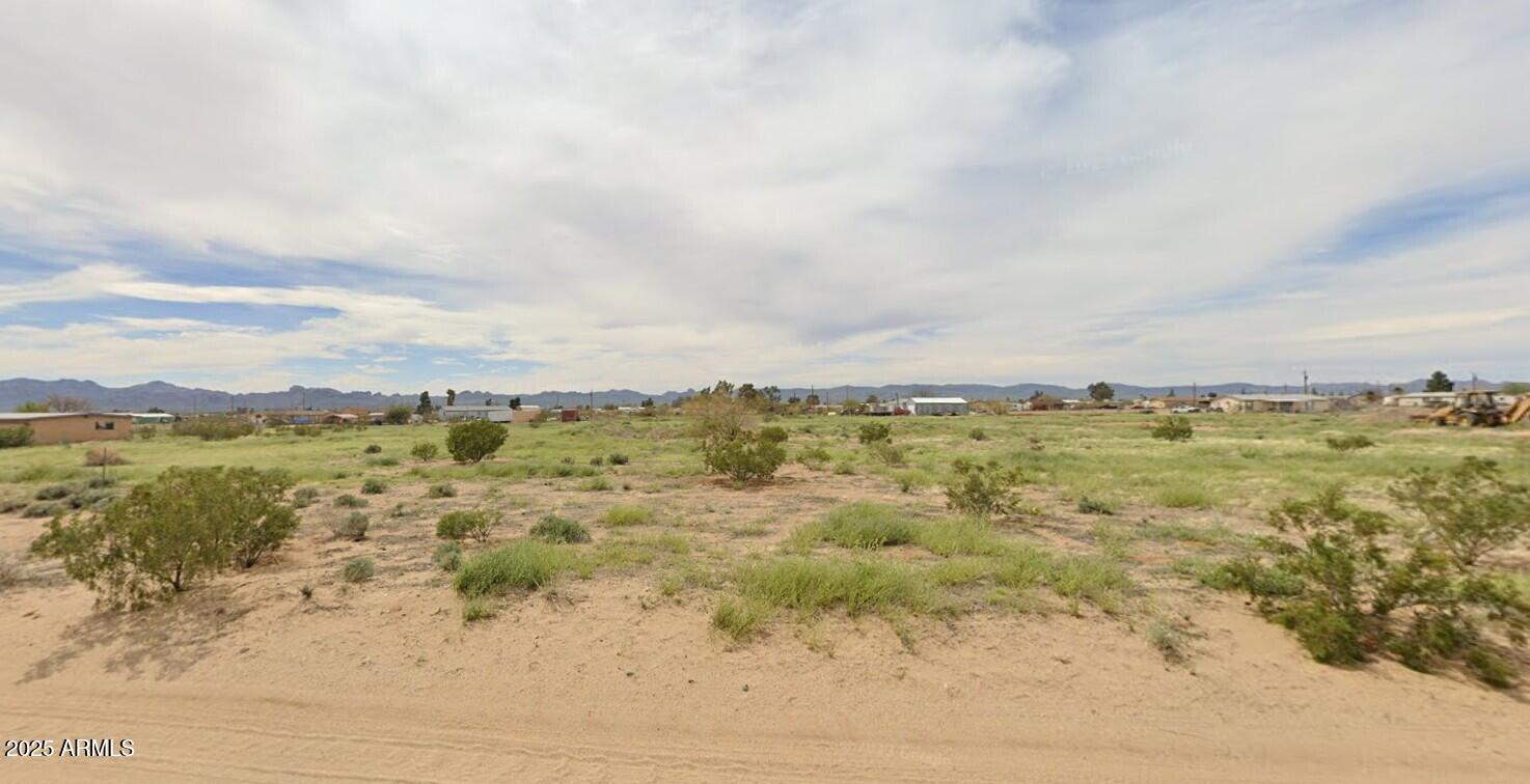 3687 Mobile Road, Unit 226 Golden Valley, AZ 86413 - Photo 3 of 6 a view of a lake with a mountain
