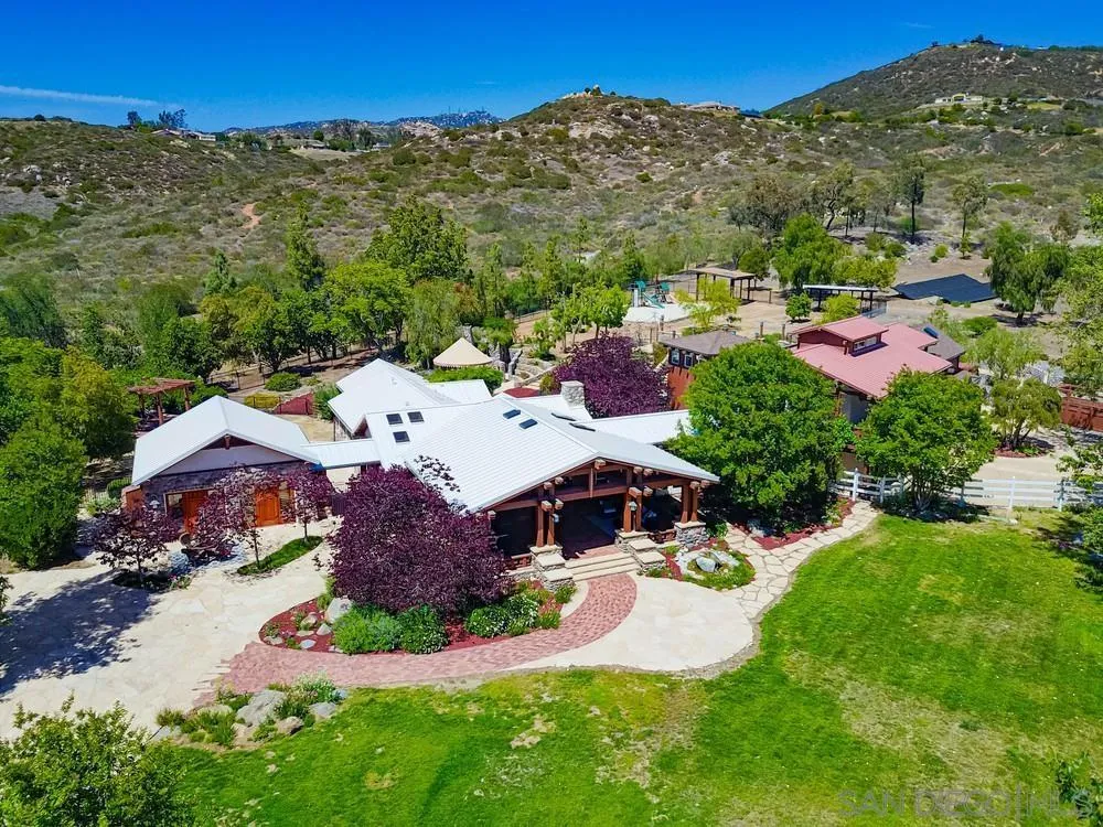 an aerial view of a house with a garden