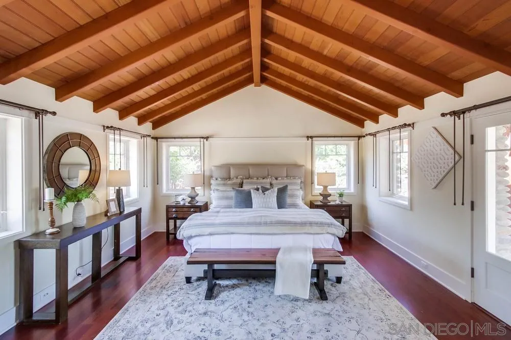 13980 Millards Ranch Lane Poway, CA 92064 - Photo 19 of 75 a bedroom with a bed a dresser next to a window