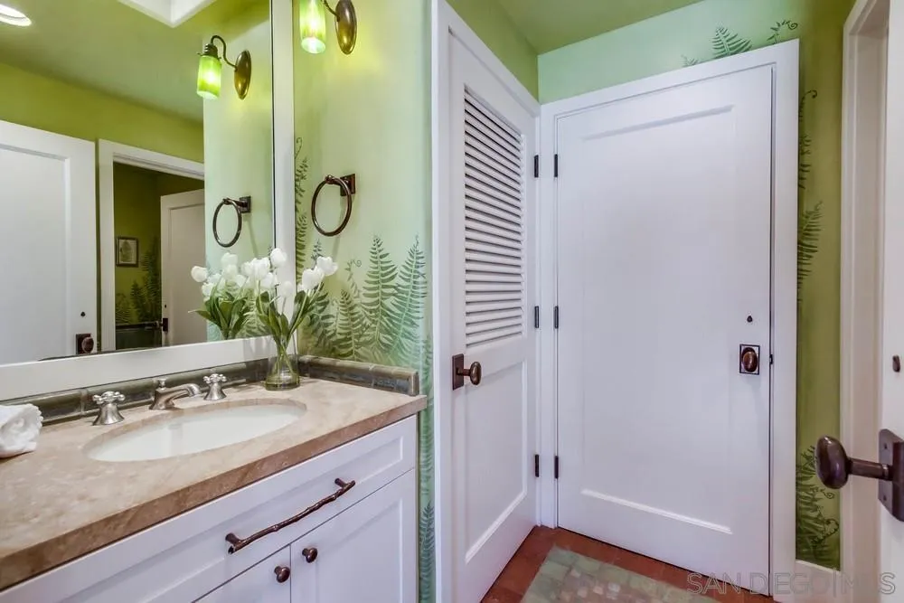 13980 Millards Ranch Lane Poway, CA 92064 - Photo 29 of 75 a bathroom with a granite countertop sink and a mirror
