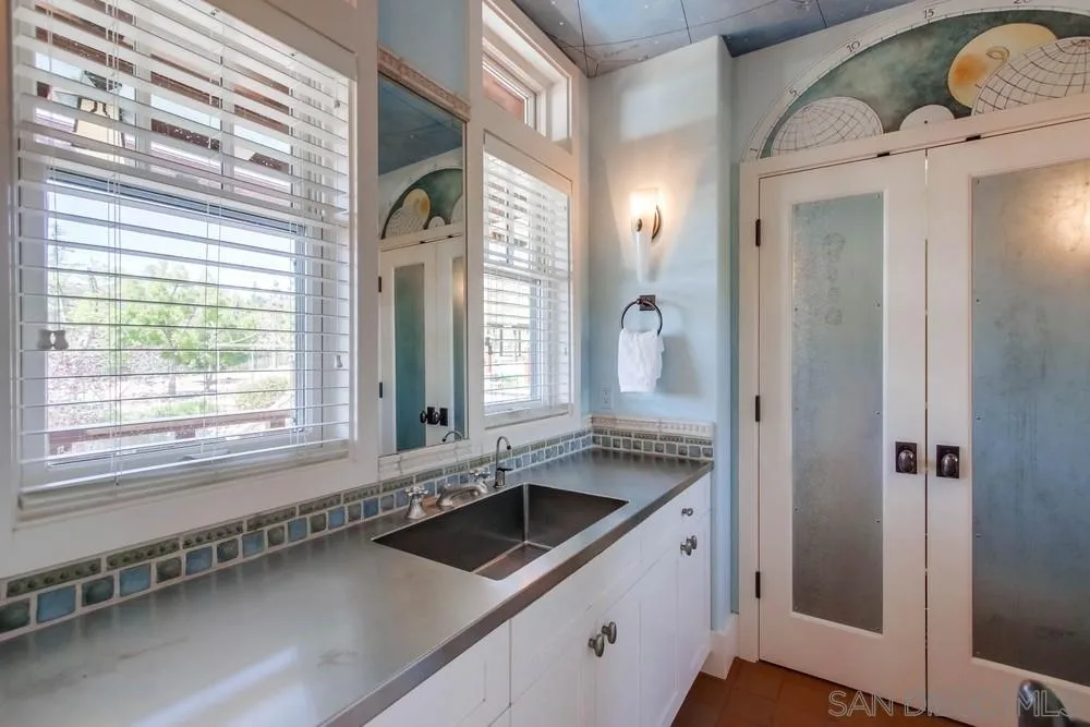 13980 Millards Ranch Lane Poway, CA 92064 - Photo 40 of 75 a bathroom with a sink and a mirror