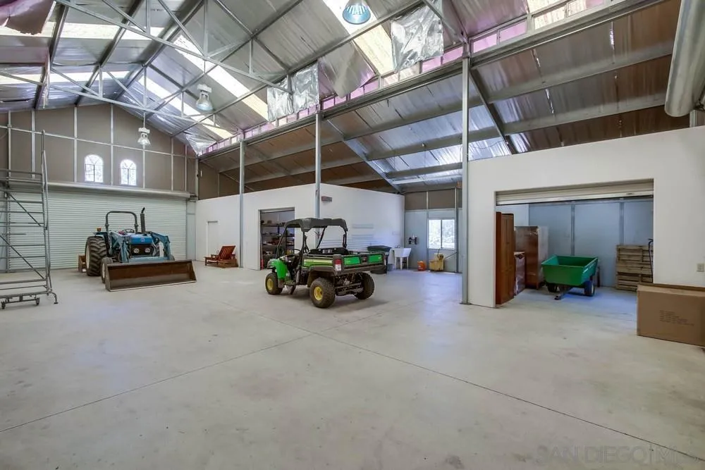 13980 Millards Ranch Lane Poway, CA 92064 - Photo 45 of 75 a view of a garage with parked cars