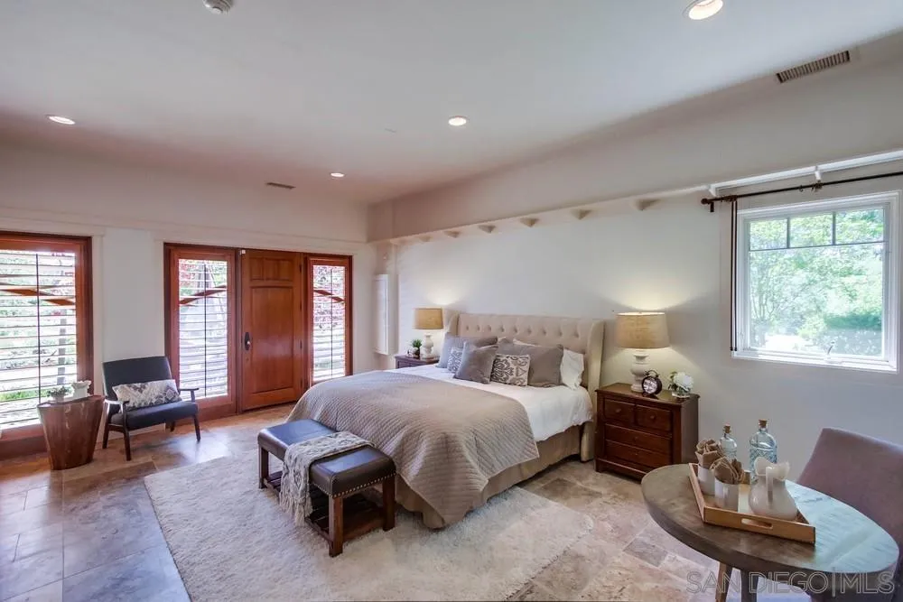 13980 Millards Ranch Lane Poway, CA 92064 - Photo 67 of 75 a spacious bedroom with a bed and wooden floor