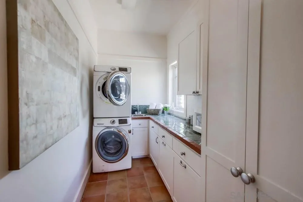 13980 Millards Ranch Lane Poway, CA 92064 - Photo 68 of 75 a utility room with sink dryer and washer