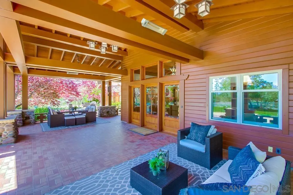 13980 Millards Ranch Lane Poway, CA 92064 - Photo 8 of 75 a living room with furniture and a floor to ceiling window