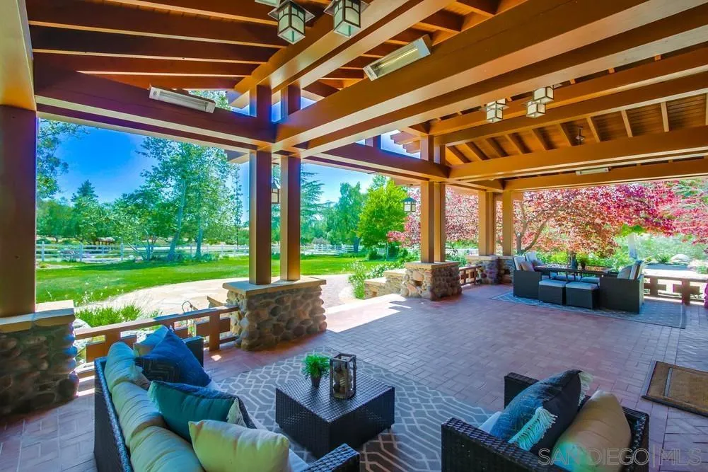 13980 Millards Ranch Lane Poway, CA 92064 - Photo 9 of 75 a living room with furniture and a floor to ceiling window