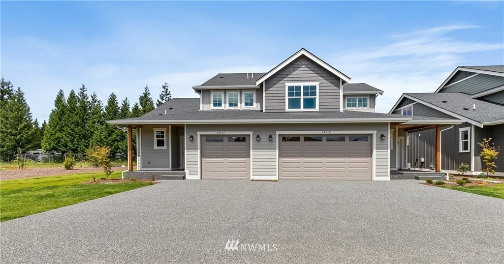 6934 Red Ridge Drive, Unit B Lynden, WA 98264 - Photo 1 of 34 a front view of a house with a yard