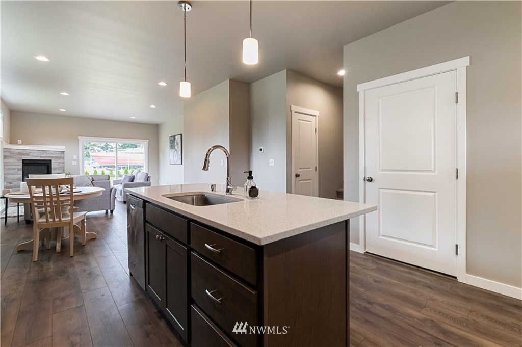 6934 Red Ridge Drive, Unit B Lynden, WA 98264 - Photo 11 of 34 a kitchen with a sink cabinets and wooden floor