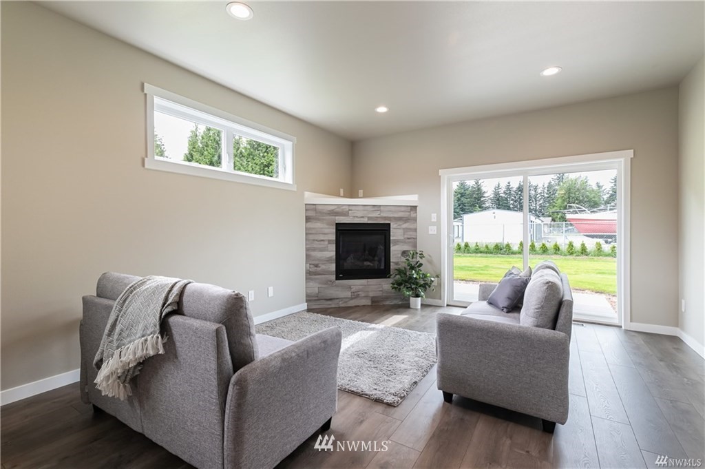 6934 Red Ridge Drive, Unit B Lynden, WA 98264 - Photo 14 of 34 a living room with furniture and a fireplace