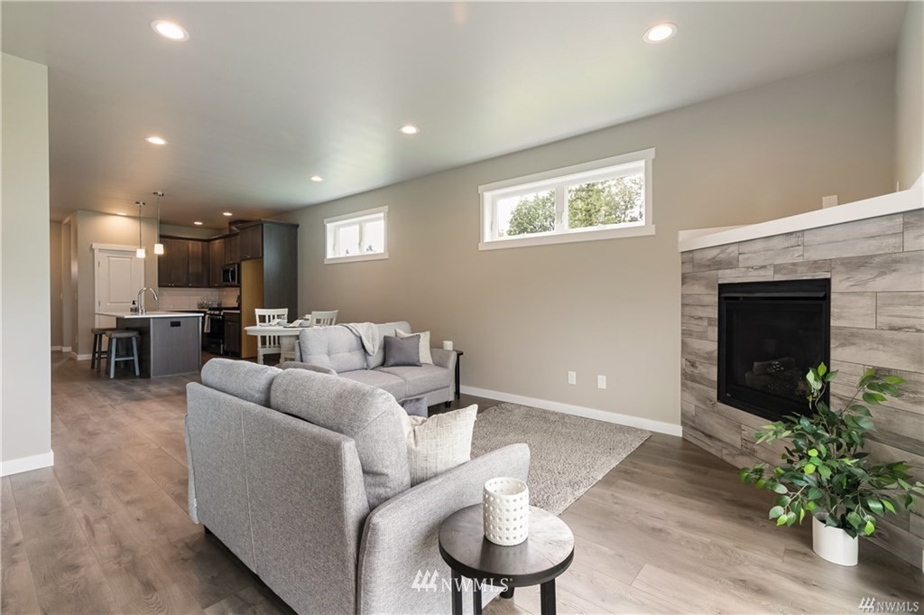 6934 Red Ridge Drive, Unit B Lynden, WA 98264 - Photo 15 of 34 a living room with furniture and a fireplace