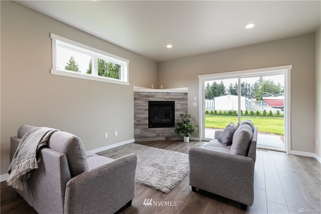 6934 Red Ridge Drive, Unit B Lynden, WA 98264 - Photo 16 of 34 a living room with furniture and a fireplace