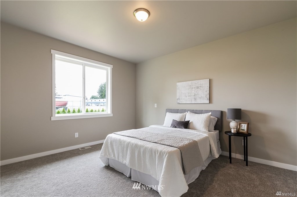 6934 Red Ridge Drive, Unit B Lynden, WA 98264 - Photo 19 of 34 a bedroom with a bed and a window