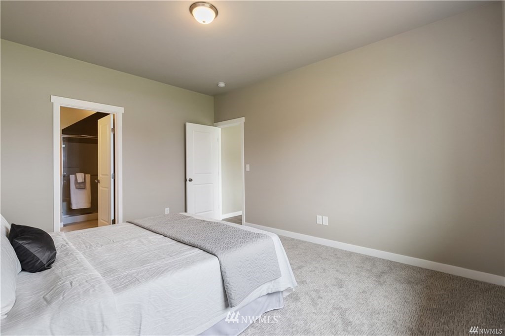 6934 Red Ridge Drive, Unit B Lynden, WA 98264 - Photo 20 of 34 a bedroom with a bed and a night stand