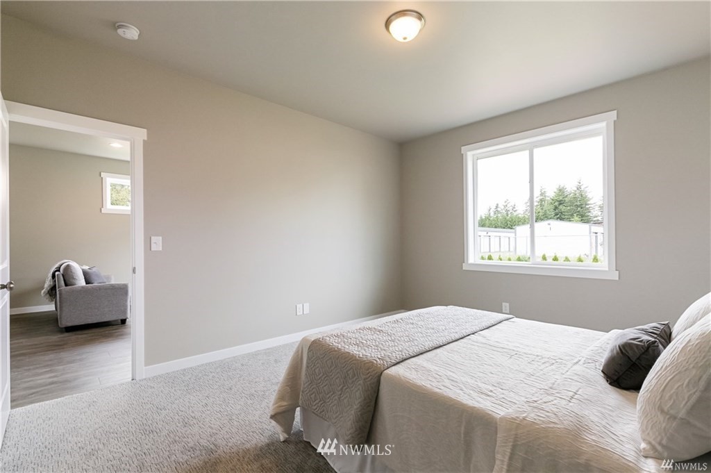 6934 Red Ridge Drive, Unit B Lynden, WA 98264 - Photo 21 of 34 a bedroom with bed and window