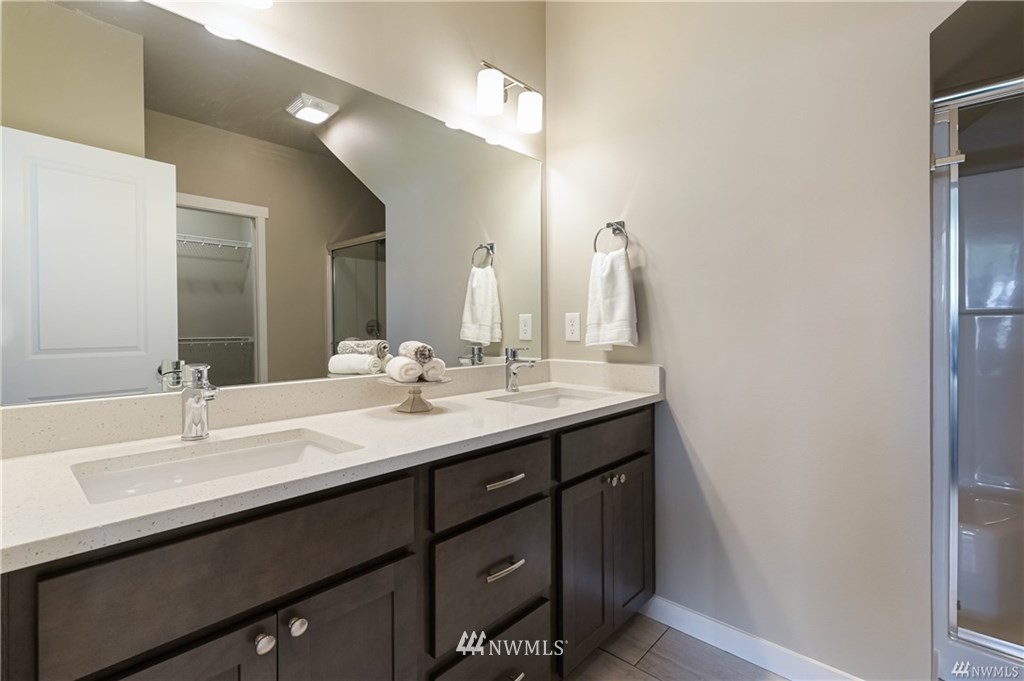 6934 Red Ridge Drive, Unit B Lynden, WA 98264 - Photo 22 of 34 a bathroom with a double vanity sink and a mirror
