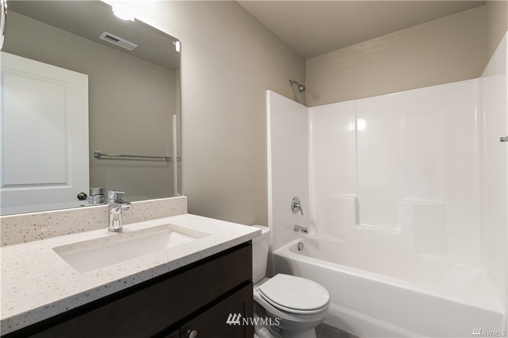 6934 Red Ridge Drive, Unit B Lynden, WA 98264 - Photo 30 of 34 a bathroom with a sink a toilet and shower