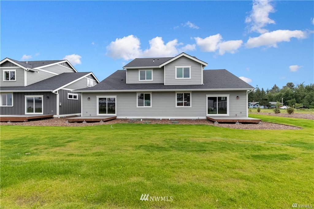 6934 Red Ridge Drive, Unit B Lynden, WA 98264 - Photo 33 of 34 a front view of a house with a garden