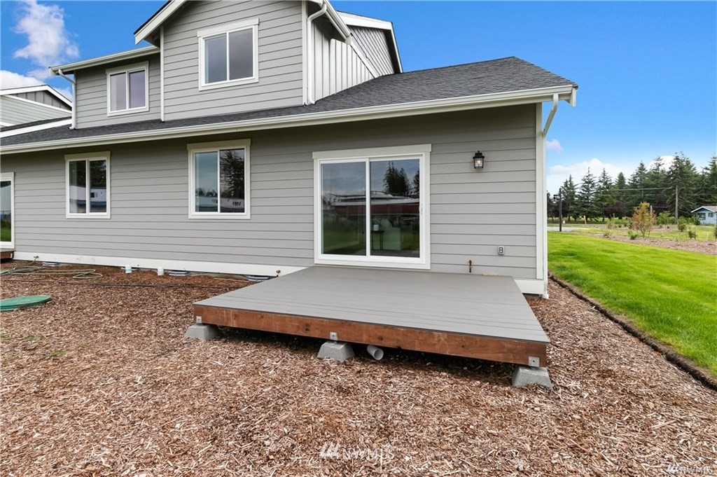 6934 Red Ridge Drive, Unit B Lynden, WA 98264 - Photo 34 of 34 a front view of a house with garden